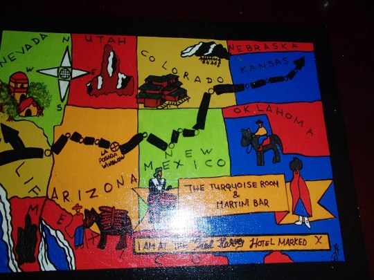 A charming travel-themed historic placemat at the Turquoise Room.